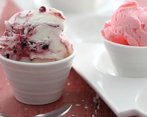 Scoops of berry ripple and strawberry gelato